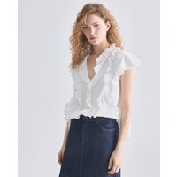 Blanxart - Blusa sin mangas con cuello V y volantes. — qué blusas y camisas de mujer se llevan en 2026 y cómo encontrarlas por foto